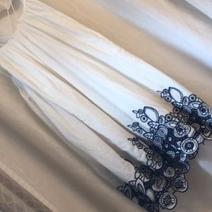 NWOT white sundress with blue embroidery.